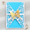 Detail of laser-cut invitation with blue card, white floral lace, and gold glitter butterfly - White Cover + Sky Blue Inner Page