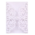 Macro detail of laser-cut white wedding invitation shell with intricate floral pattern - White