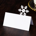 Laser cut white snowflake place cards for elegant Christmas or wedding table settings - White
