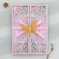 Laser-cut pink glitter wedding invitation with floral sleeve, ribbon, and golden butterfly - Pink Style (44#)