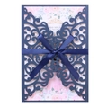 Detail of navy blue laser cut wedding invitation with satin bow and floral inner card - Magic Blue