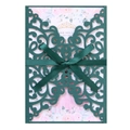 Detail of dark green laser cut wedding invitation with silk ribbon and floral insert - Ink Green
