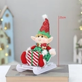 Christmas elf doll in red and green with gift box on white sled, 25cm high - Sitting Red Sleigh Style (QD24B621A)