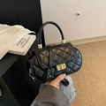 Classic black quilted crossbody bag with golden rectangular turn-lock and round handle - Black