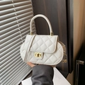 White quilted crossbody bag with luxury gold lock and elegant handle for women - White