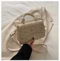 Beige woven straw crossbody bag with floral embroidery and elegant top handle - White