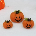 Three orange plush Halloween pumpkins with jack-o-lantern faces and green leaves - Smile Face Pattern Set (T1230130) / Set of 3