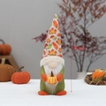 Plush Thanksgiving gnome with maple leaf hat holding a pumpkin, harvest decor, 31cm height - Luminous Maple Pumpkin (HX-2257A)