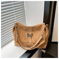 Detail of brown pleated PU leather bag with silver butterfly clasp and chain strap - Brown