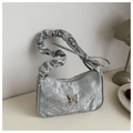 Detail of silver metallic hobo bag with crushed texture and butterfly metal buckle - Silver