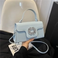 Light blue faux leather crossbody bag with sparkling rhinestone buckle detail - Blue