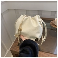 Cream drawstring bucket bag in textured leather with gold chain and metal accents - Bucket Type / White Without Pendant