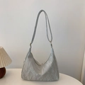 Sleek light gray hobo bag with pleated texture and adjustable strap in minimalist style - Silver