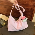 Pink pleated hobo bag with adjustable strap and cute white puppy plush charm - Pink With Pendant