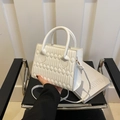 Elegant white quilted crossbody handbag with diamond stitching and round handle - White
