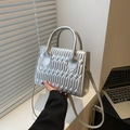 Metallic silver crossbody bag with quilted pleated texture and top handles for women - Silver