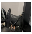 Detail of black pebbled leather crossbody bag featuring long tassels and gold hardware - Black