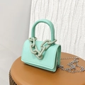 Mint green leather crossbody bag with bold grey chain and metallic strap - Green