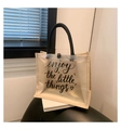 Close-up of PVC tote bag with linen splicing and Enjoy the Little Things printed text - Style 5 (Enjoy the Little Things)