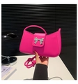 Detail of silver bow clasp on magenta leather handbag with premium smooth finish - Rose Red