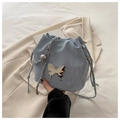 Light blue drawstring bucket bag with silver butterfly charm and chain shoulder strap - Blue Without Charm