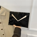 Chic black envelope clutch bag with crinkled texture and golden V-shaped metal hardware - Black