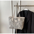 Chic cream-colored shoulder tote bag featuring a trendy black leopard print pattern - Beige