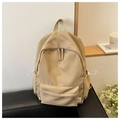 Detail of khaki nylon backpack with large front pocket and white drawstring side pockets - Khaki