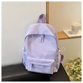 Close-up of a light purple nylon backpack featuring functional white drawstring side pockets - Purple
