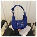Detail of royal blue crescent bag with crocodile texture and gold metal buckle - Blue