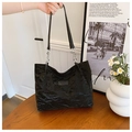 Chic black pleated tote bag with silver chain strap and fashionable text label - Black