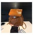 Caramel brown leather backpack with drawstring closure and silver metallic buckle - Brown