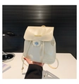 Creamy white glossy PU leather backpack with silver turn-lock and flap design - Beige