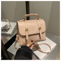 Detail of nude pink faux leather crossbody bag with vintage crackle texture and gold ring - Pink
