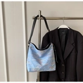 Light blue textured tote bag with rainbow embroidery and adjustable black strap - Blue
