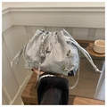 Silver metallic drawstring bucket bag featuring 3D butterfly charms and chain strap - Silver