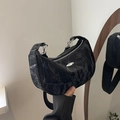 Black wrinkled crescent crossbody bag with silver hardware and wide shoulder strap - Black