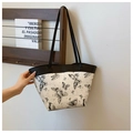 Detail of artistic butterfly and constellation print on a white large tote bag - Black