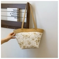 Detailed close-up of butterfly print tote bag on a wooden stand in a lifestyle setting - Khaki