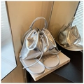 Silver metallic drawstring bucket bag with textured finish and versatile straps - Silver