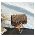 Detail of vintage brown monogram crossbody bag with elegant gold bead chain strap - Brown