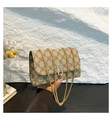 Detail of clover pattern crossbody bag with golden chain strap and metallic lock - Khaki