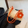 White bubble texture shoulder bag with bright orange handle and floral charm accessory - White and Orange