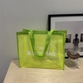 Neon green mesh beach tote bag featuring white bold text print and webbed handles - Yellow With White Lettering