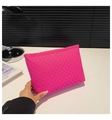 Hot pink envelope clutch with woven texture in a minimalist summer fashion style - Rose Red