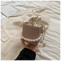 Brown woven bucket bag with large pearl handle and cream drawstring lining - Khaki