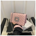 Detail of light pink chevron quilted leather bag with sparkling silver rhinestone buckle - Pink