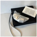 Detailed view of silver croissant bag featuring classic stitching and metallic finish - Silver