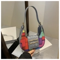 Grey suede crescent shoulder bag featuring vibrant geometric color-block patchwork - Patterned Grey