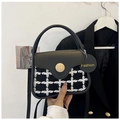 Detail of checkered plaid mini handbag with wooden button and black leather handle - Black